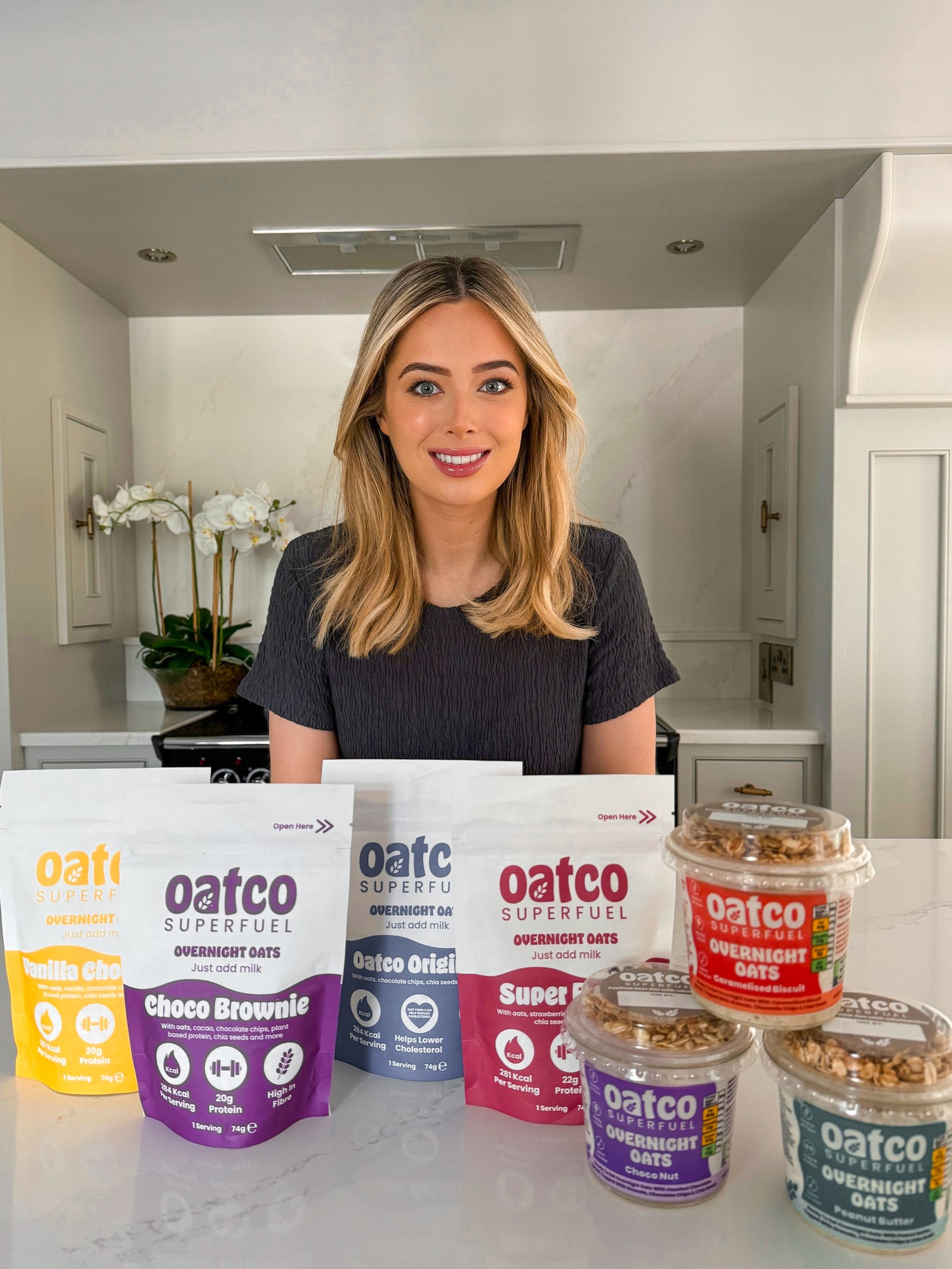 Laura the founder of Oatco with Oatco products